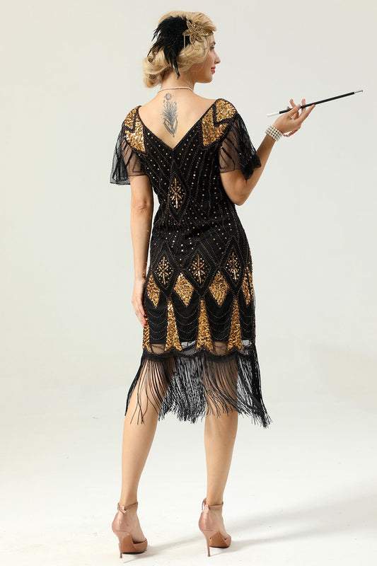 Vestido dorado con flecos estilo años 20