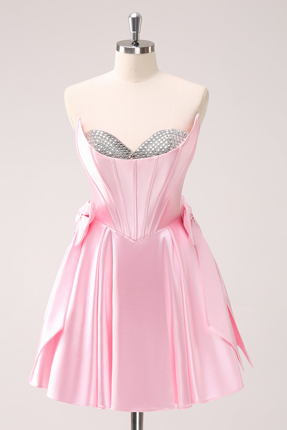 Robe de bal bustier rose ornée de perles avec nœuds