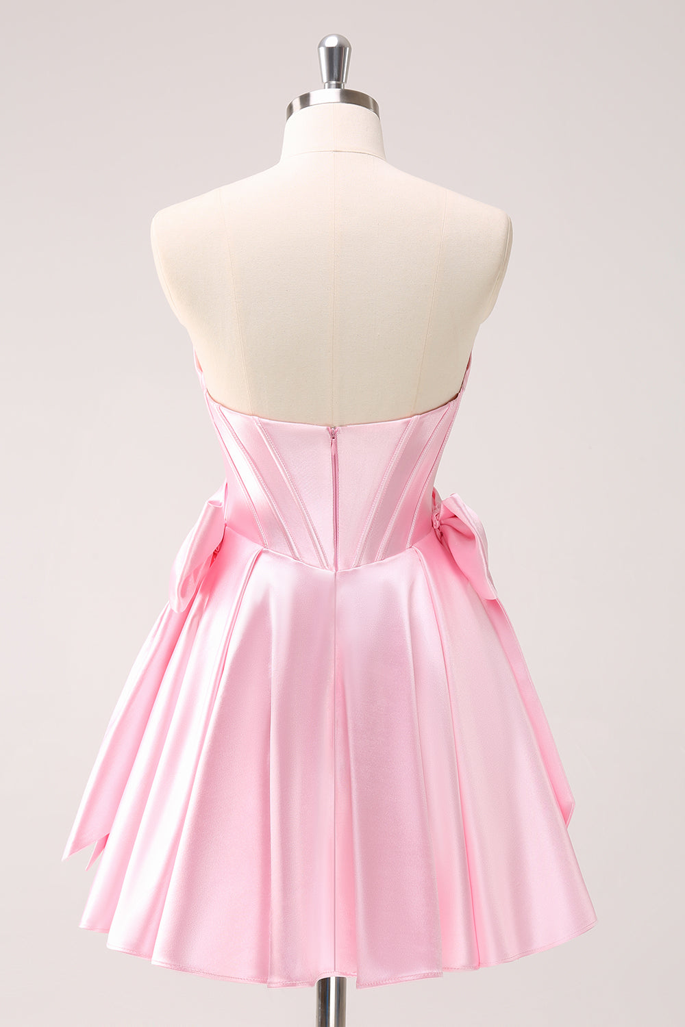 Robe de bal bustier rose ornée de perles avec nœuds