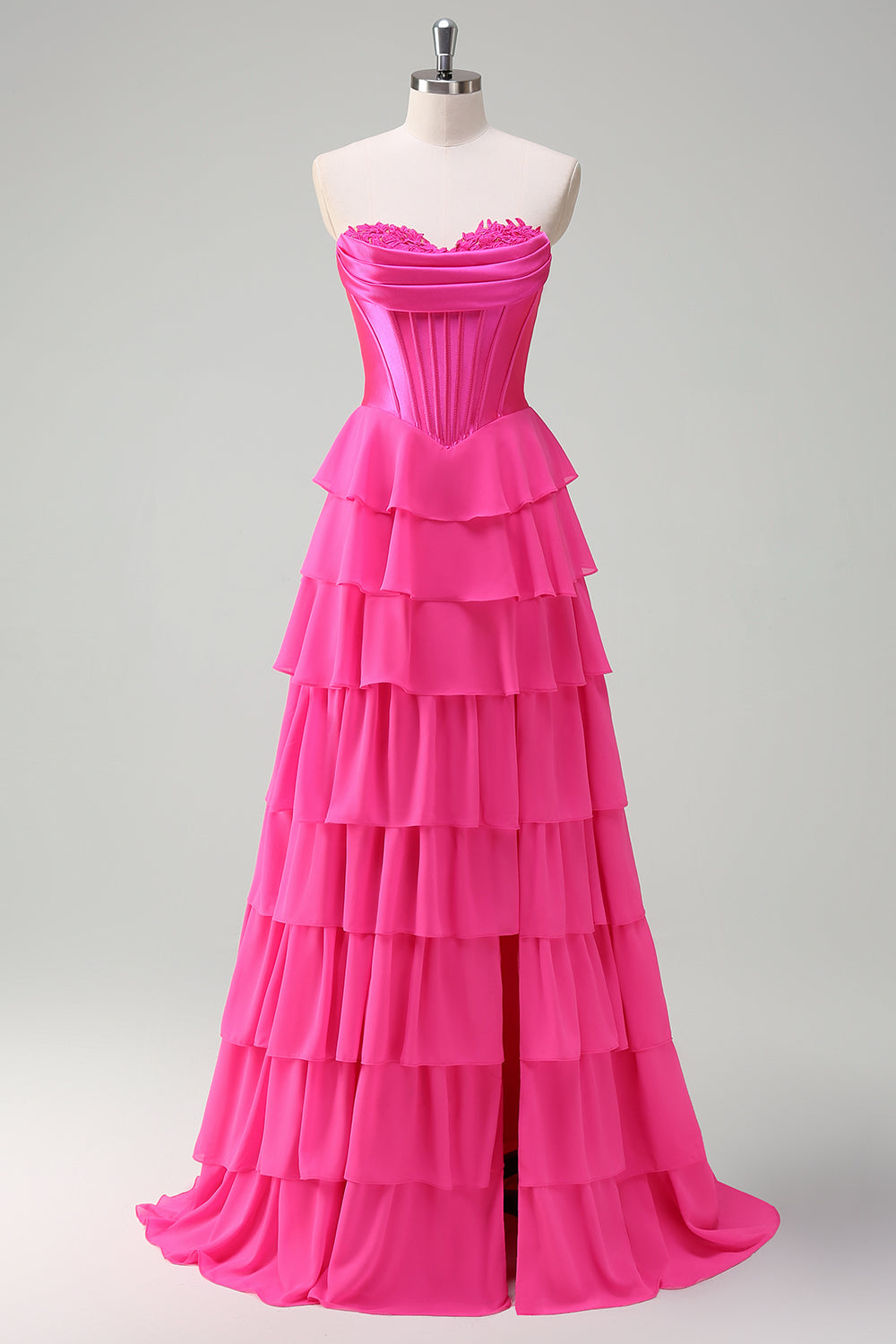 Robe de bal bustier fuchsia en ligne A avec corset, jupe étagée et volants