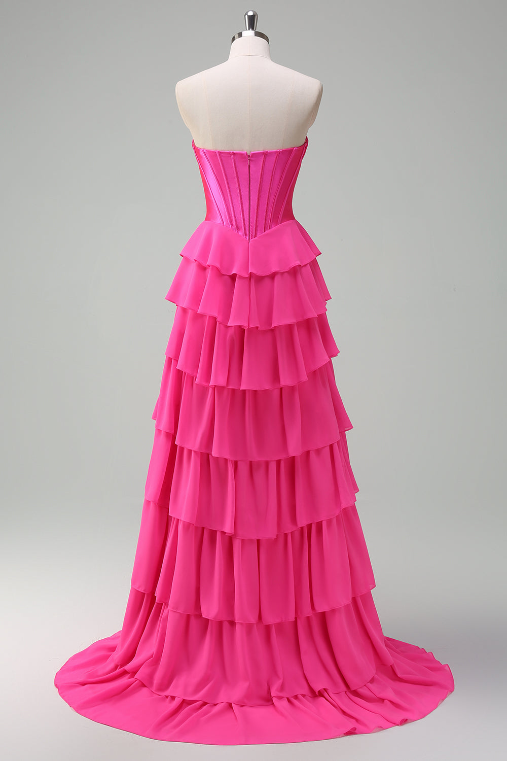 Robe de bal bustier fuchsia en ligne A avec corset, jupe étagée et volants