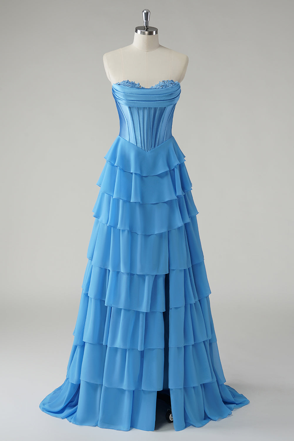 Robe de bal bustier fuchsia en ligne A avec corset, jupe étagée et volants