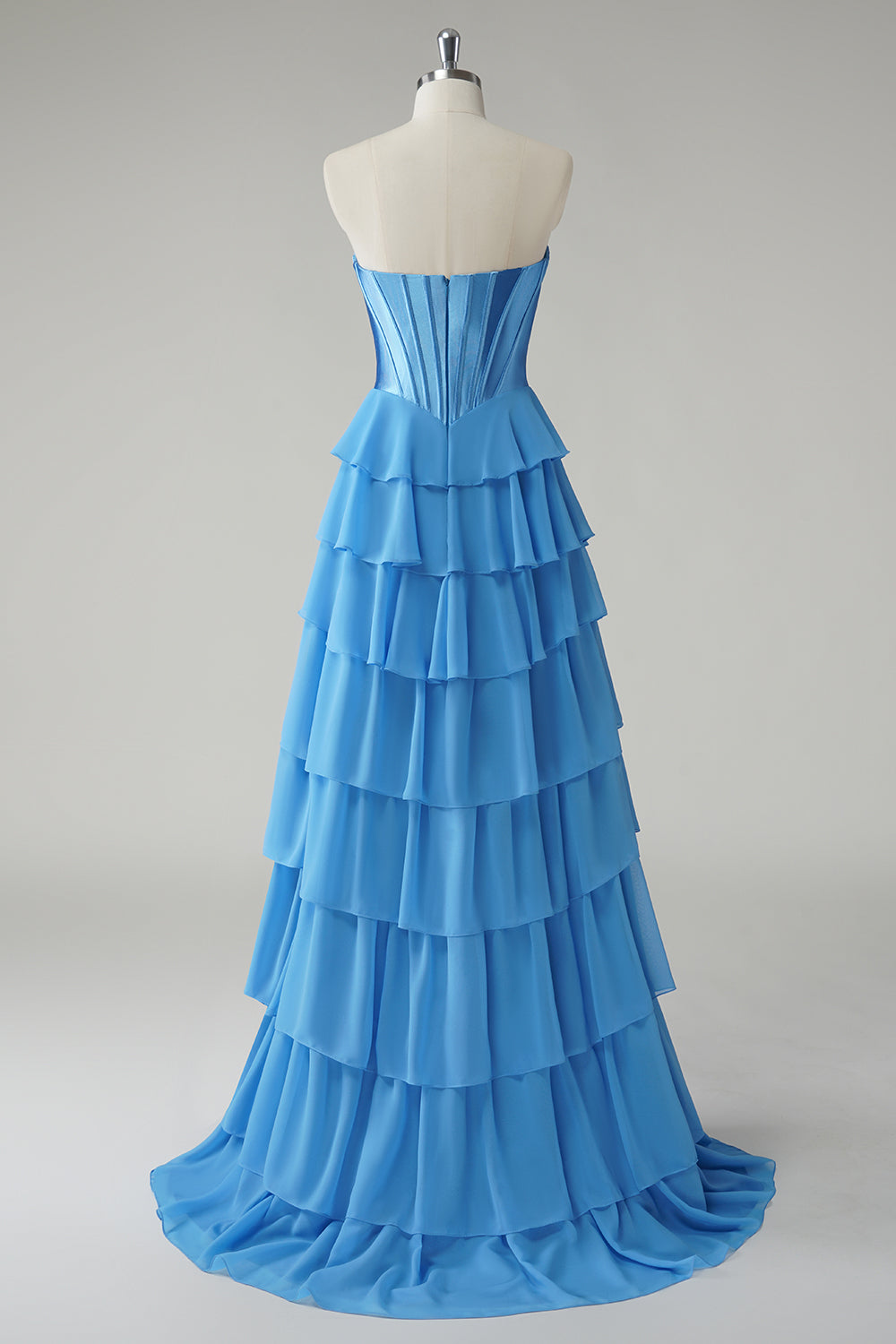 Robe de bal bustier fuchsia en ligne A avec corset, jupe étagée et volants