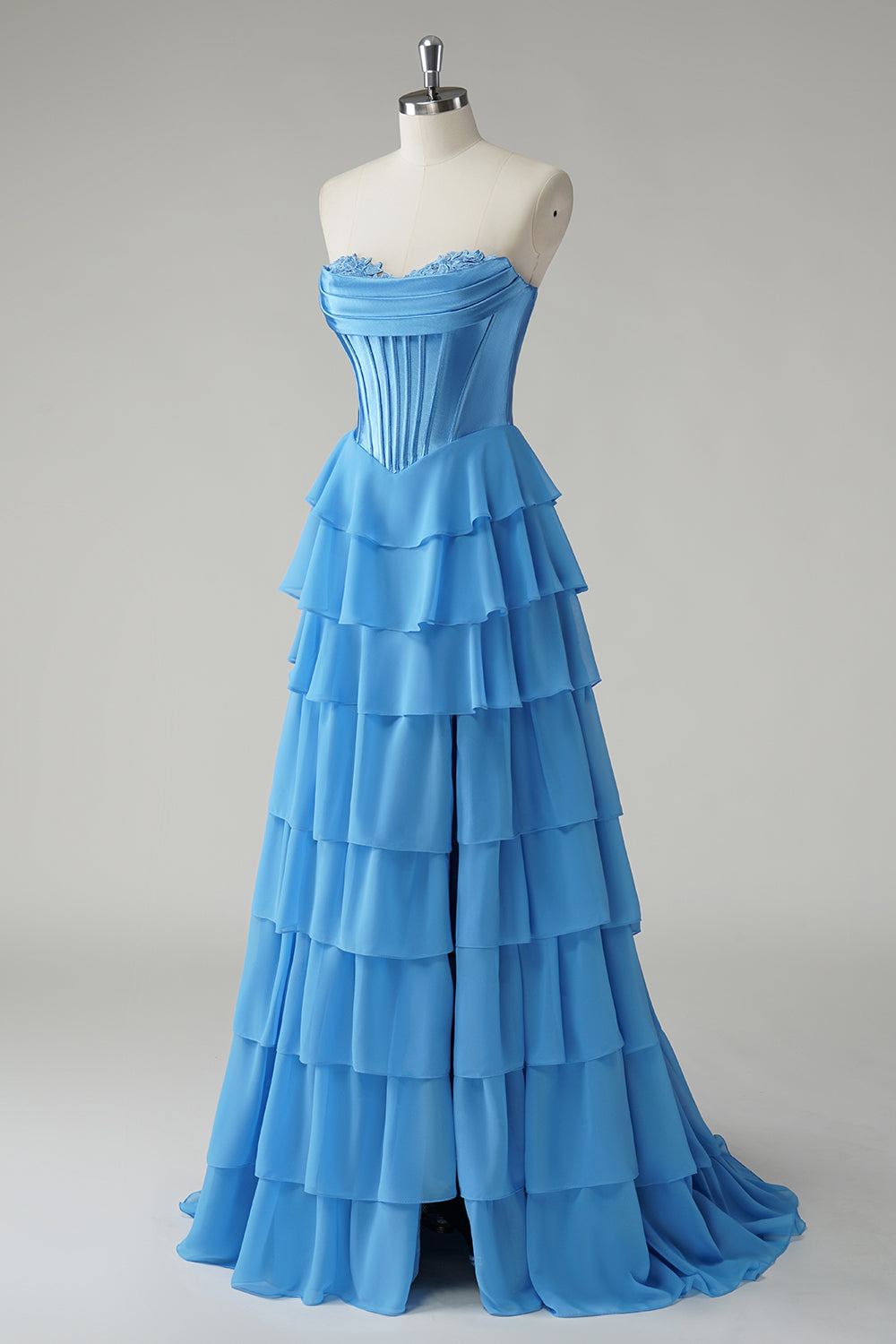 Robe de bal bustier fuchsia en ligne A avec corset, jupe étagée et volants