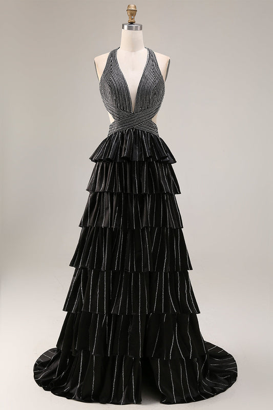 Robe de bal longue fendue noire trapèze à volants étagés, dos nu perlé et col licou