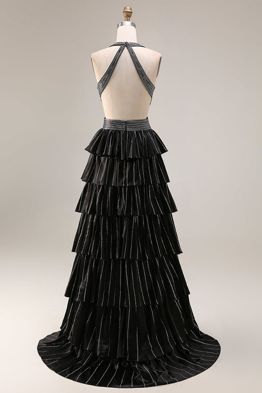 Robe de bal longue fendue noire trapèze à volants étagés, dos nu perlé et col licou