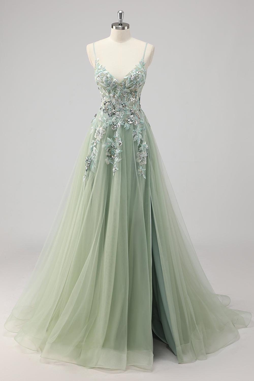 Robe de bal trapèze verte ornée de paillettes et d'appliqués, avec fente