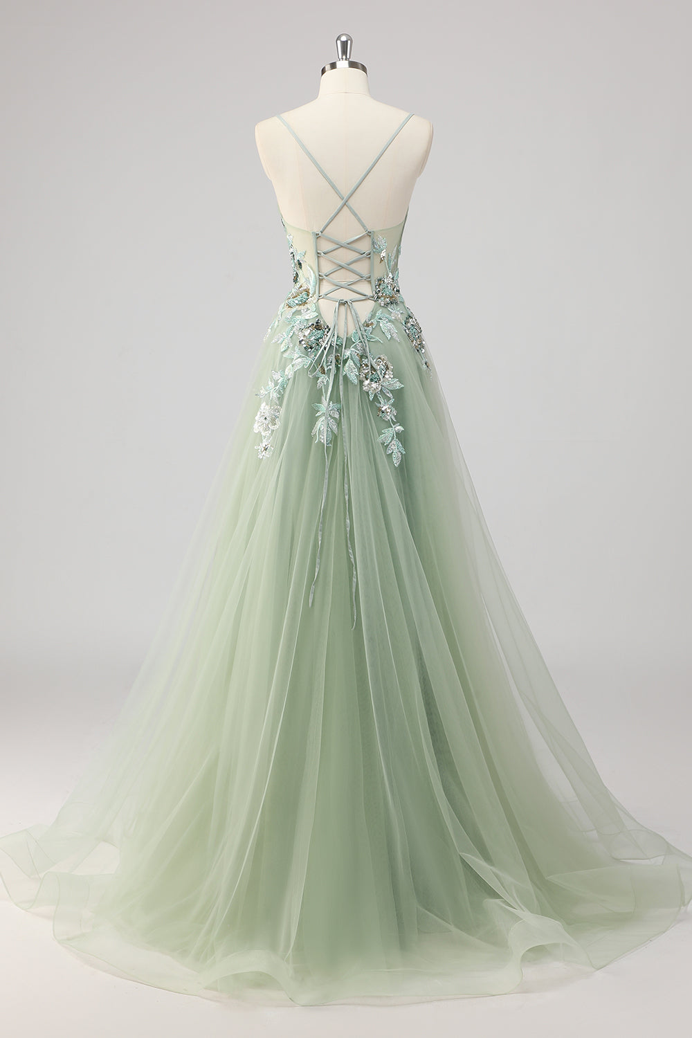 Robe de bal trapèze verte ornée de paillettes et d'appliqués, avec fente