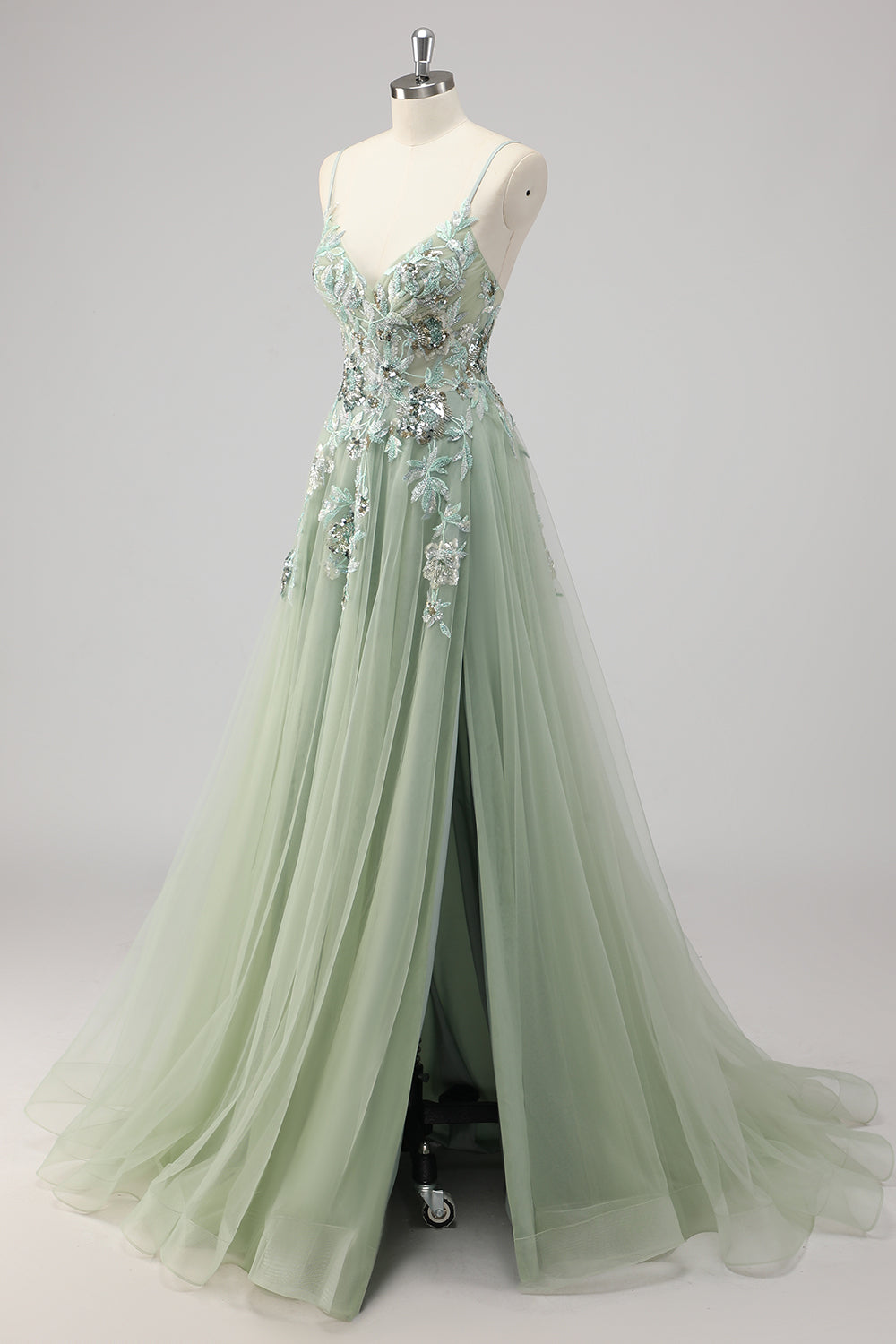 Robe de bal trapèze verte ornée de paillettes et d'appliqués, avec fente