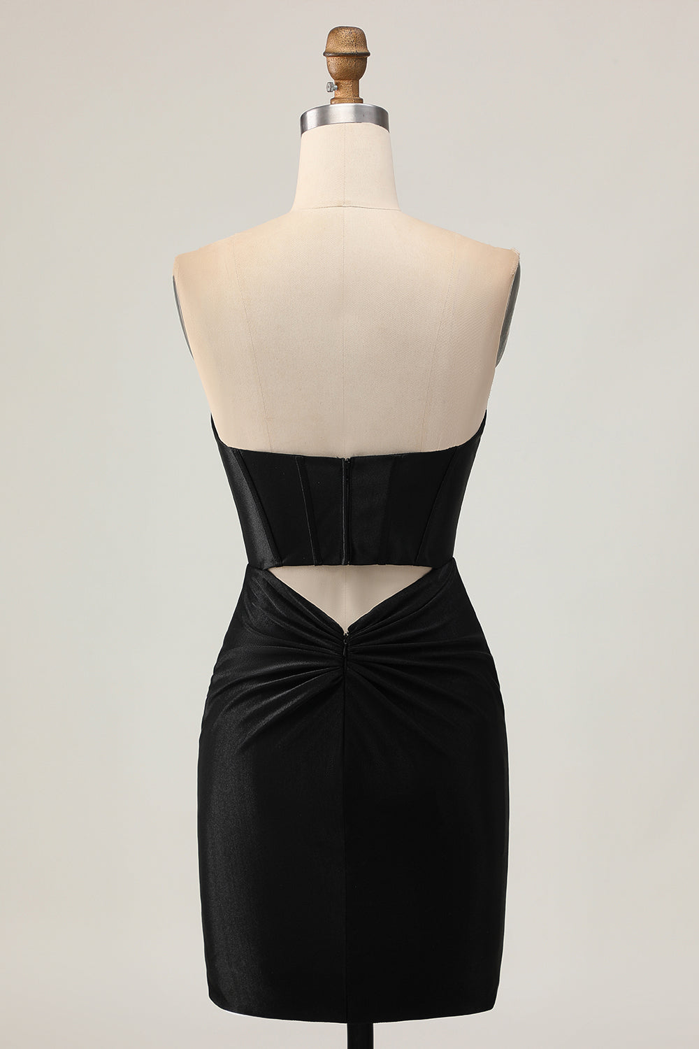 Robe de cocktail corset noire moulante ornée de perles et de découpes