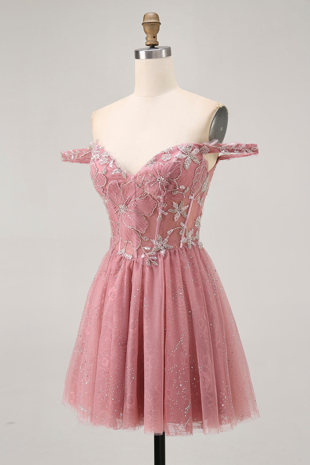 Robe de cocktail trapèze fleurie rose poudré épaules dénudées