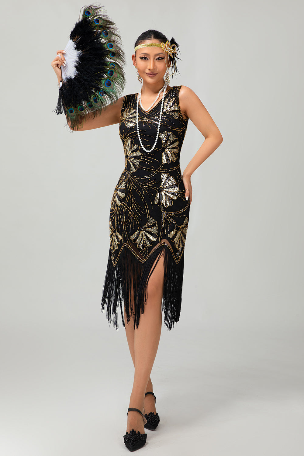 Robe Charleston noire scintillante à franges dorées