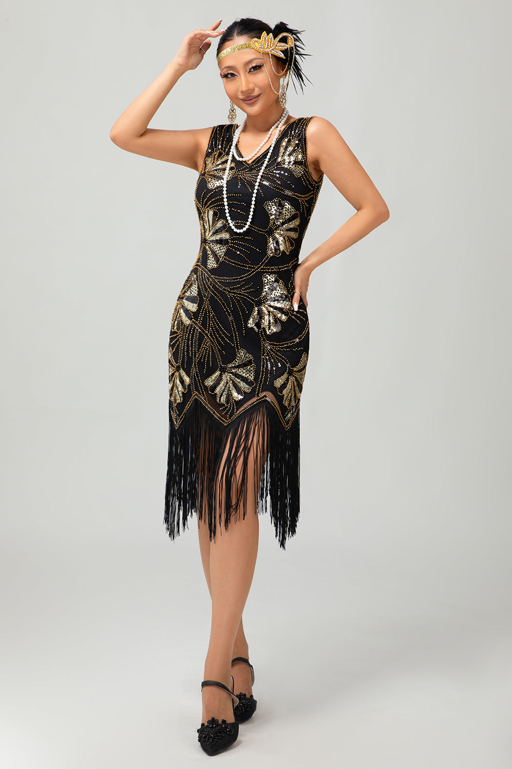 Robe Charleston noire scintillante à franges dorées