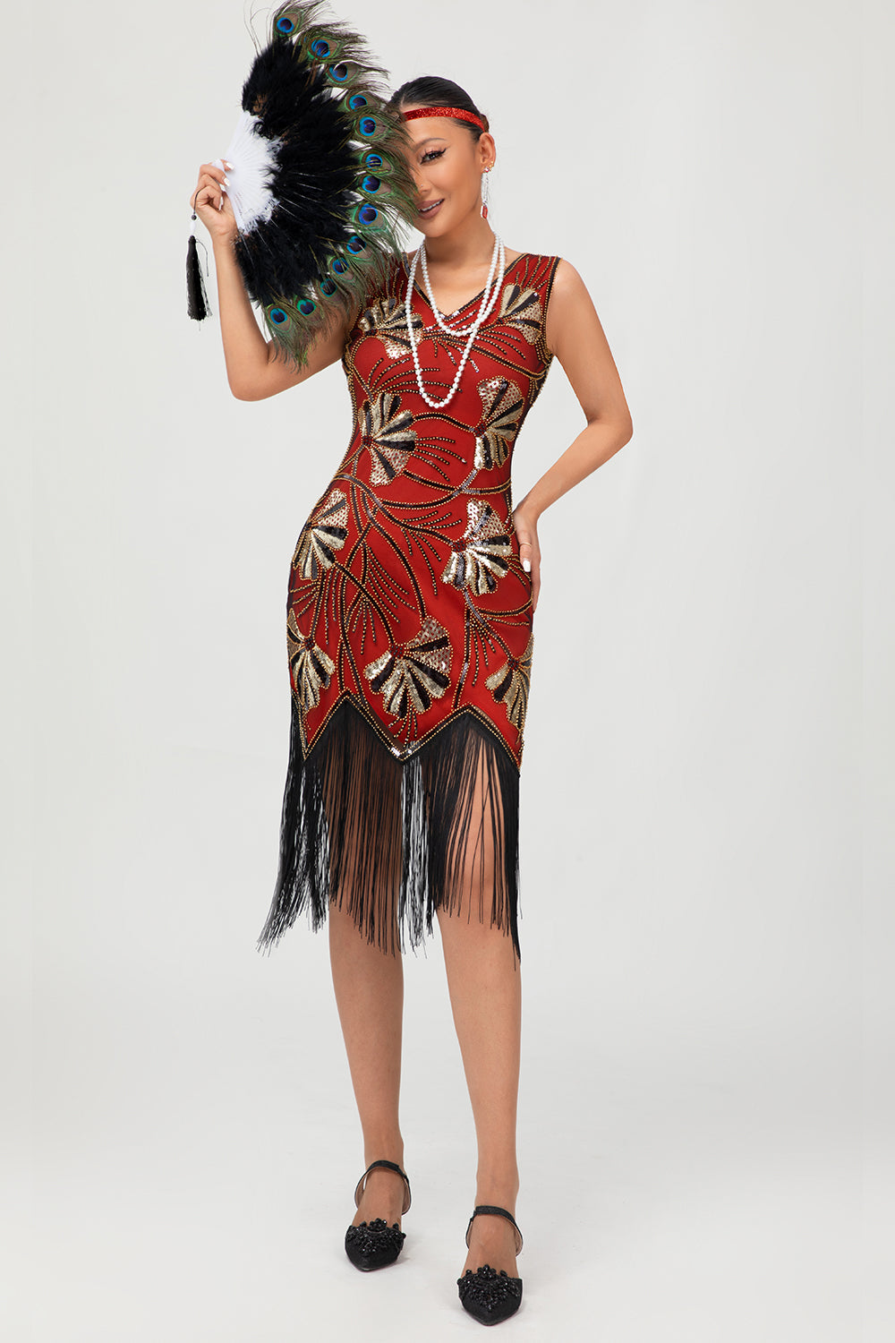 Robe Charleston noire scintillante à franges dorées