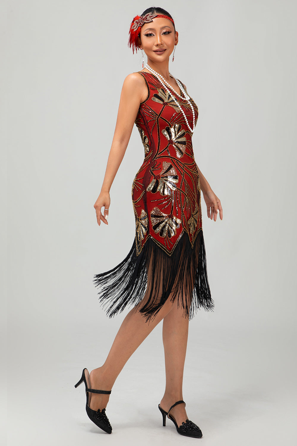 Robe Charleston noire scintillante à franges dorées
