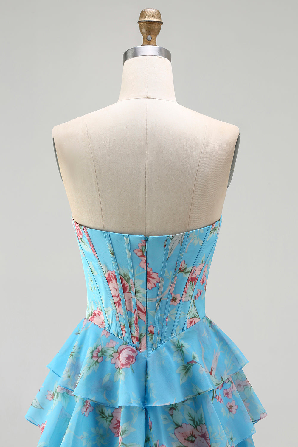 Robe de bal longue bleu foncé sans bretelles coupe trapèze avec bustier corset floral et jupe en mousseline à volants
