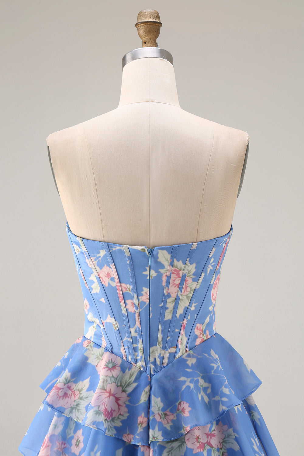 Robe de bal longue bleu foncé sans bretelles coupe trapèze avec bustier corset floral et jupe en mousseline à volants
