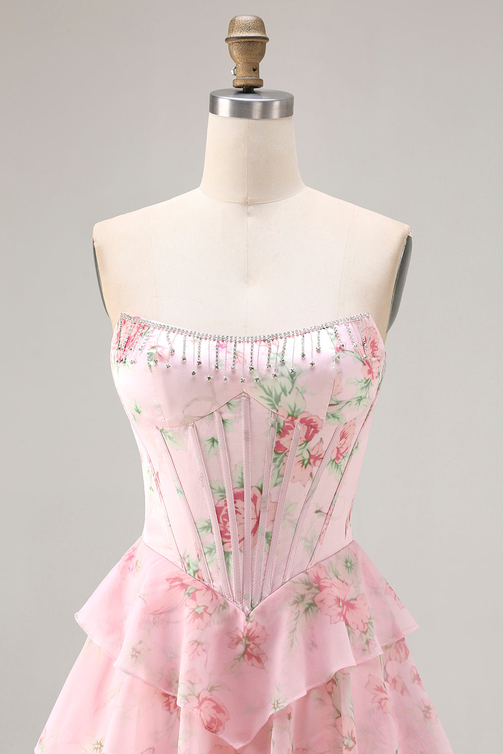 Robe de bal longue bleu foncé sans bretelles coupe trapèze avec bustier corset floral et jupe en mousseline à volants