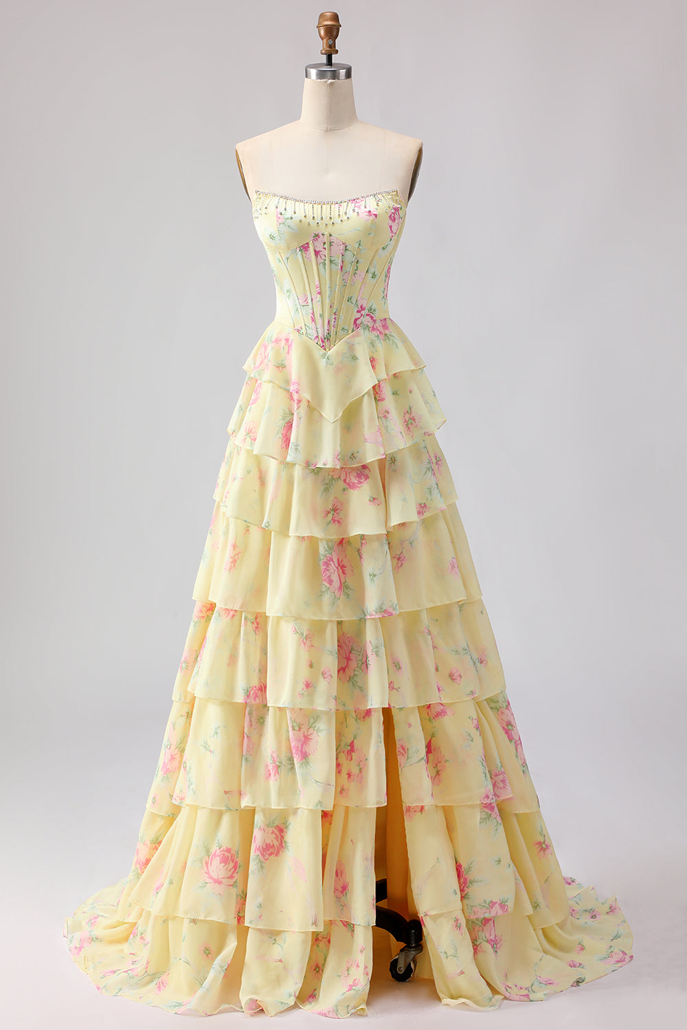 Robe de bal longue bleu foncé sans bretelles coupe trapèze avec bustier corset floral et jupe en mousseline à volants