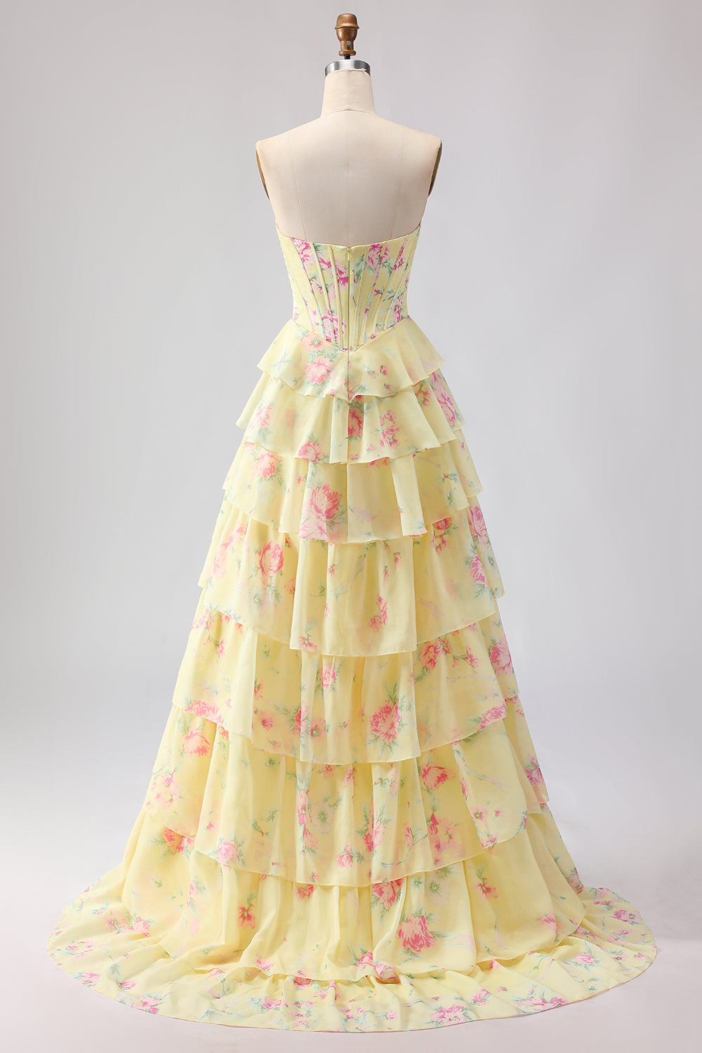 Robe de bal longue bleu foncé sans bretelles coupe trapèze avec bustier corset floral et jupe en mousseline à volants