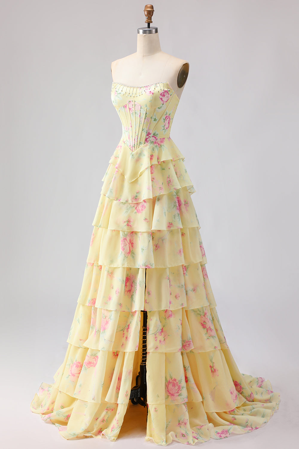 Robe de bal longue jaune sans bretelles, coupe trapèze avec corset, motif floral et jupe en mousseline à volants