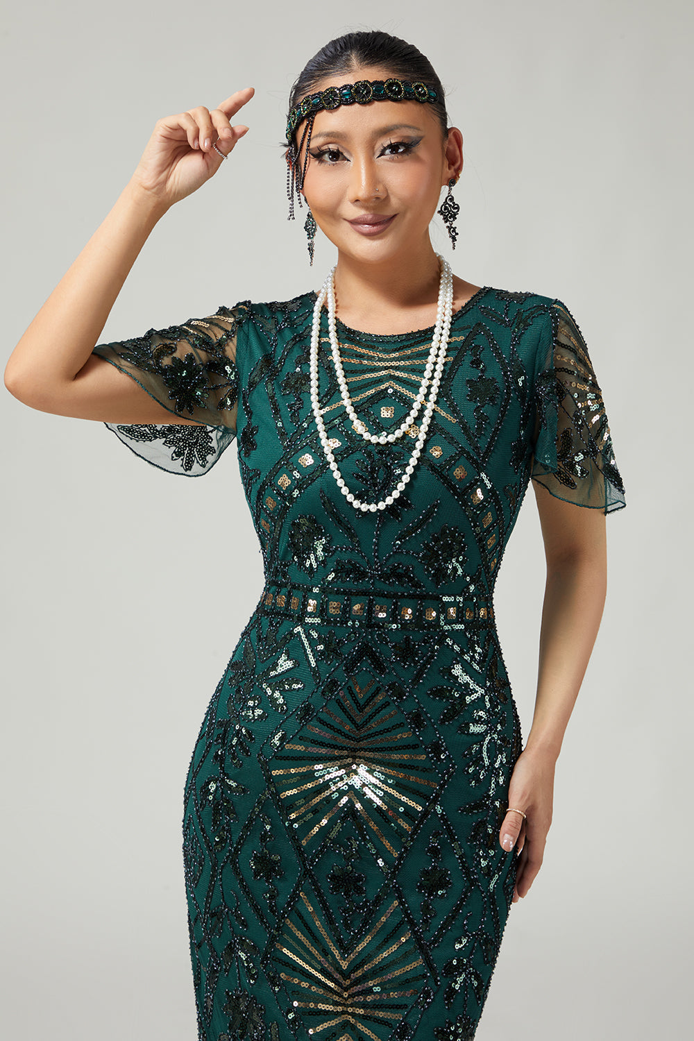 Robe crayon vert foncé scintillante style années 20 avec franges