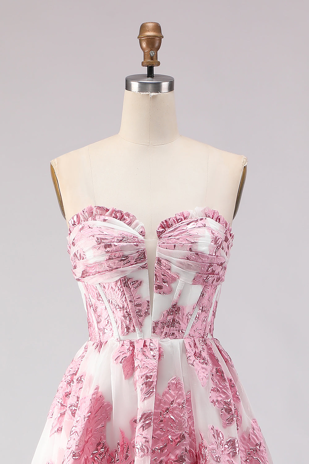 Robe de bal longue en jacquard rose coupe trapèze, bustier et fente