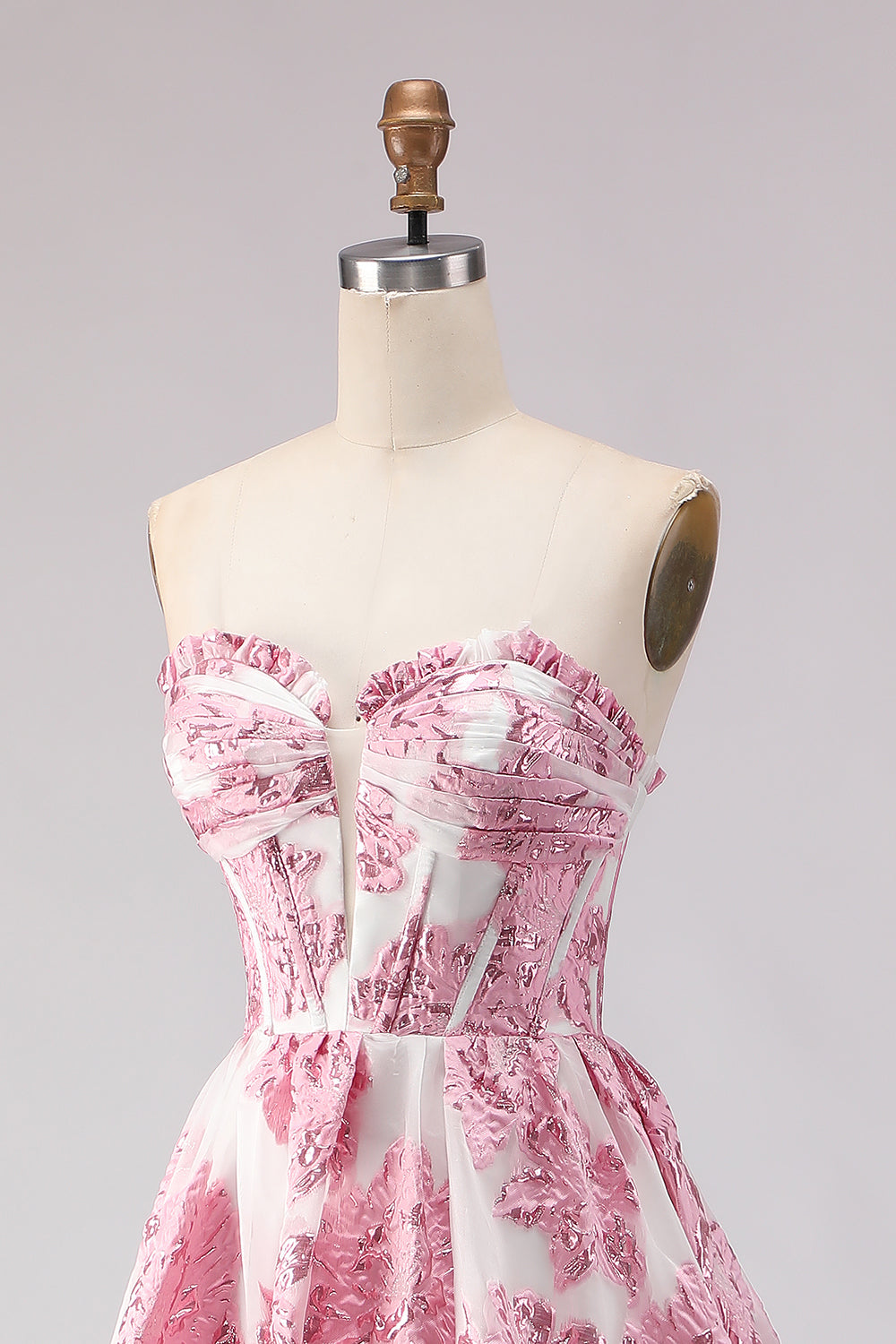 Robe de bal longue en jacquard rose coupe trapèze, bustier et fente