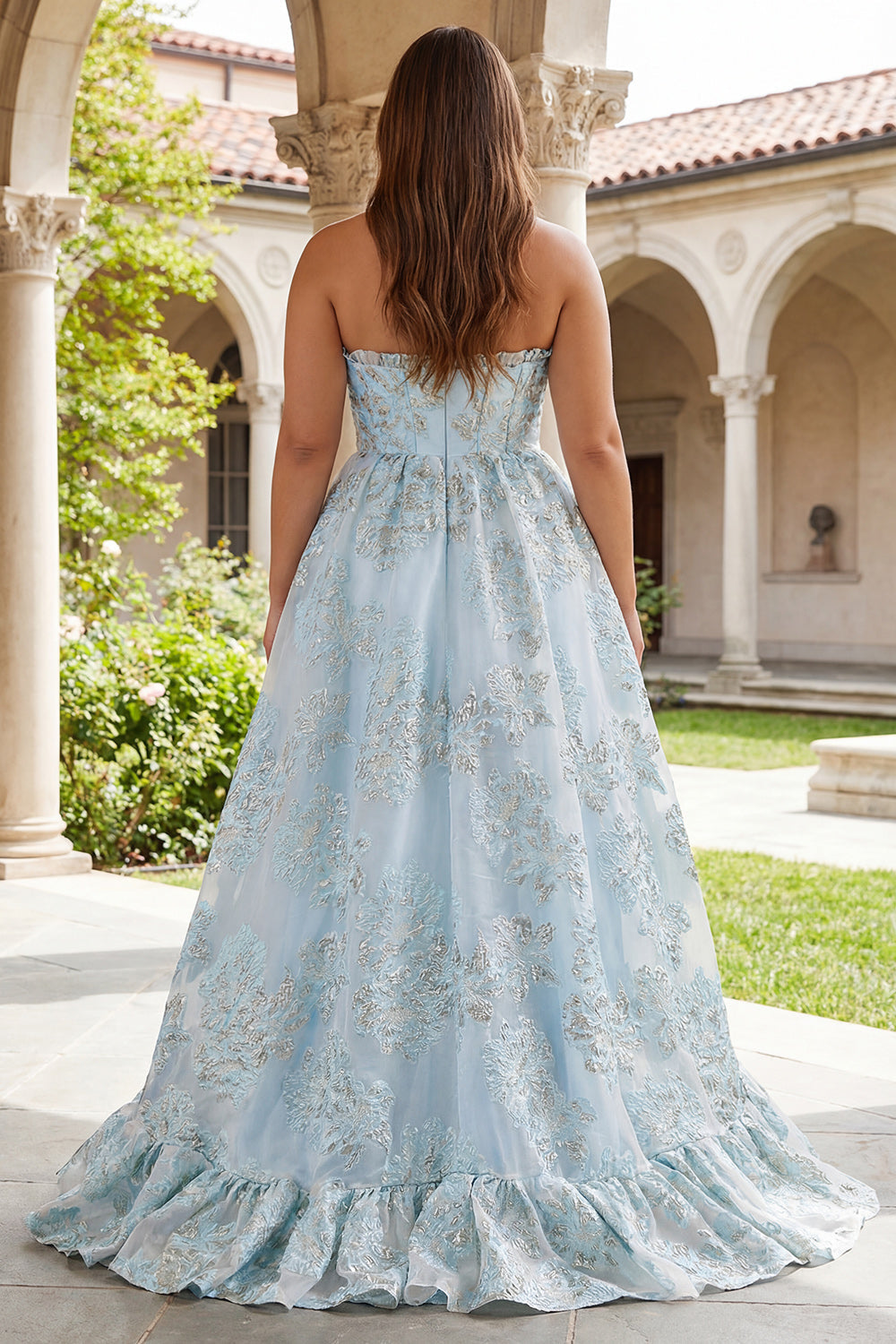Robe de bal longue en jacquard rose coupe trapèze, bustier et fente
