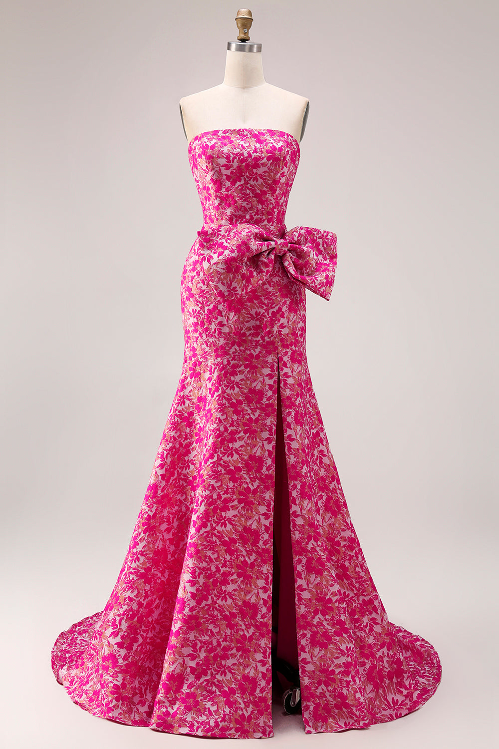 Vestido largo de fiesta tipo sirena con abertura lateral, estampado floral fucsia y lazo, sin tirantes