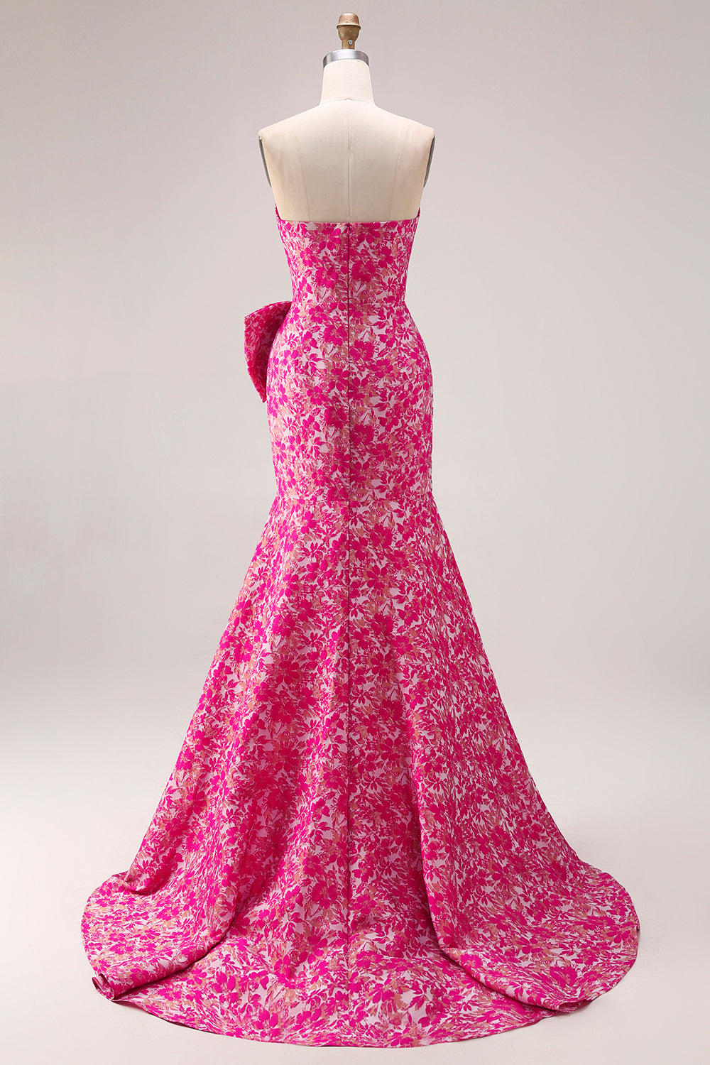 Vestido largo de fiesta tipo sirena con abertura lateral, estampado floral fucsia y lazo, sin tirantes