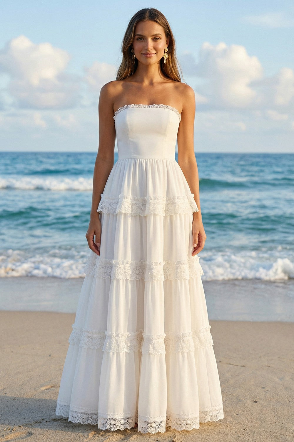 Vestido de novia largo sin tirantes color marfil estilo A con capas