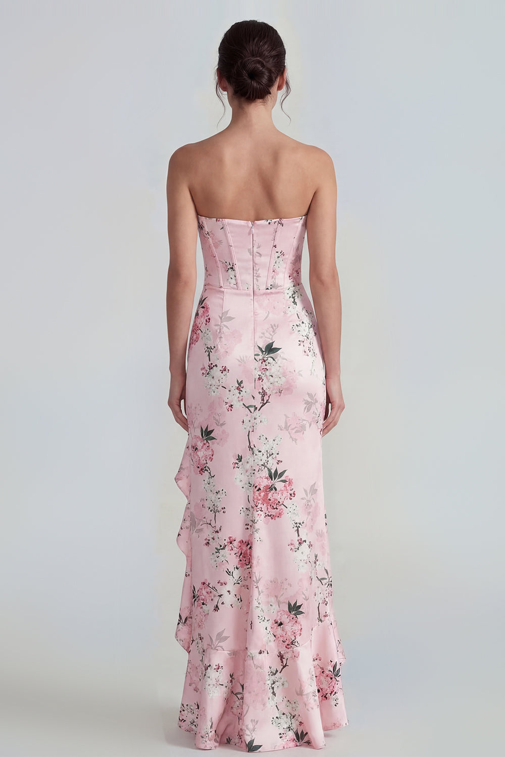 Robe longue fourreau bustier rose à corset et motif floral, avec fente à volants