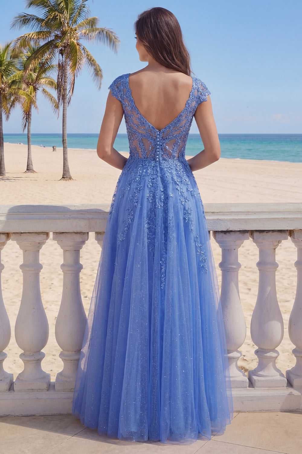 Robe longue de soirée bleu foncé coupe trapèze avec corset et col en V ornée d'appliqués