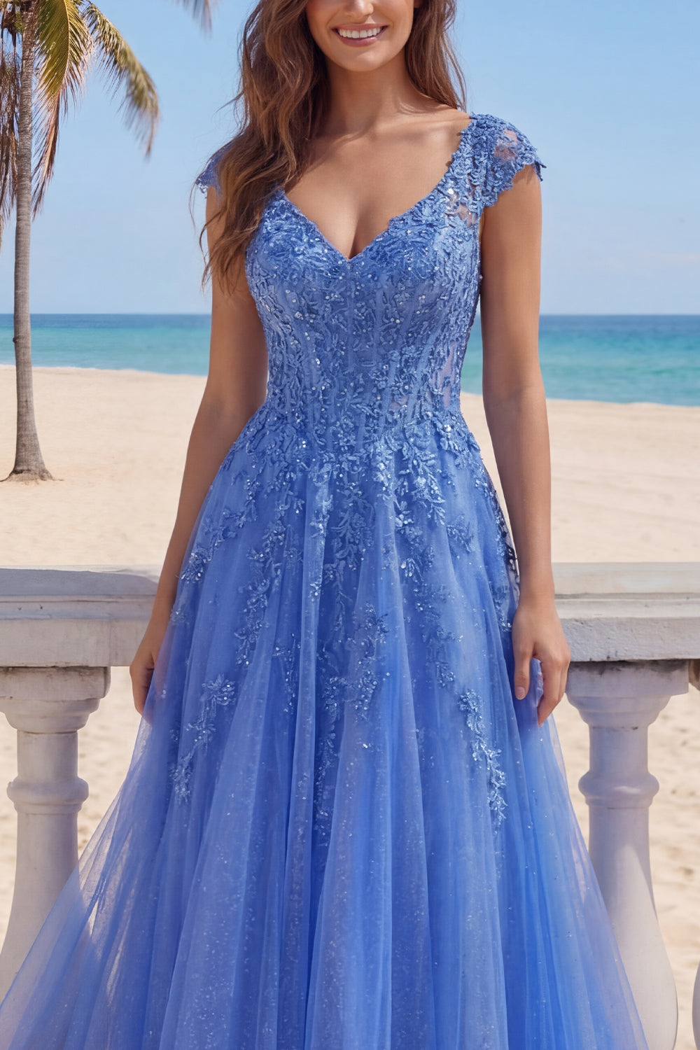 Robe longue de soirée bleu foncé coupe trapèze avec corset et col en V ornée d'appliqués