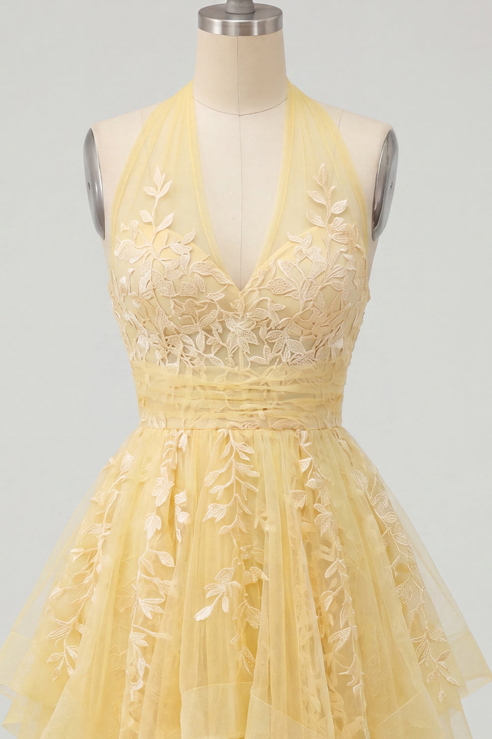 Robe de bal de fin d'année florale trapèze jaune beurre à licou