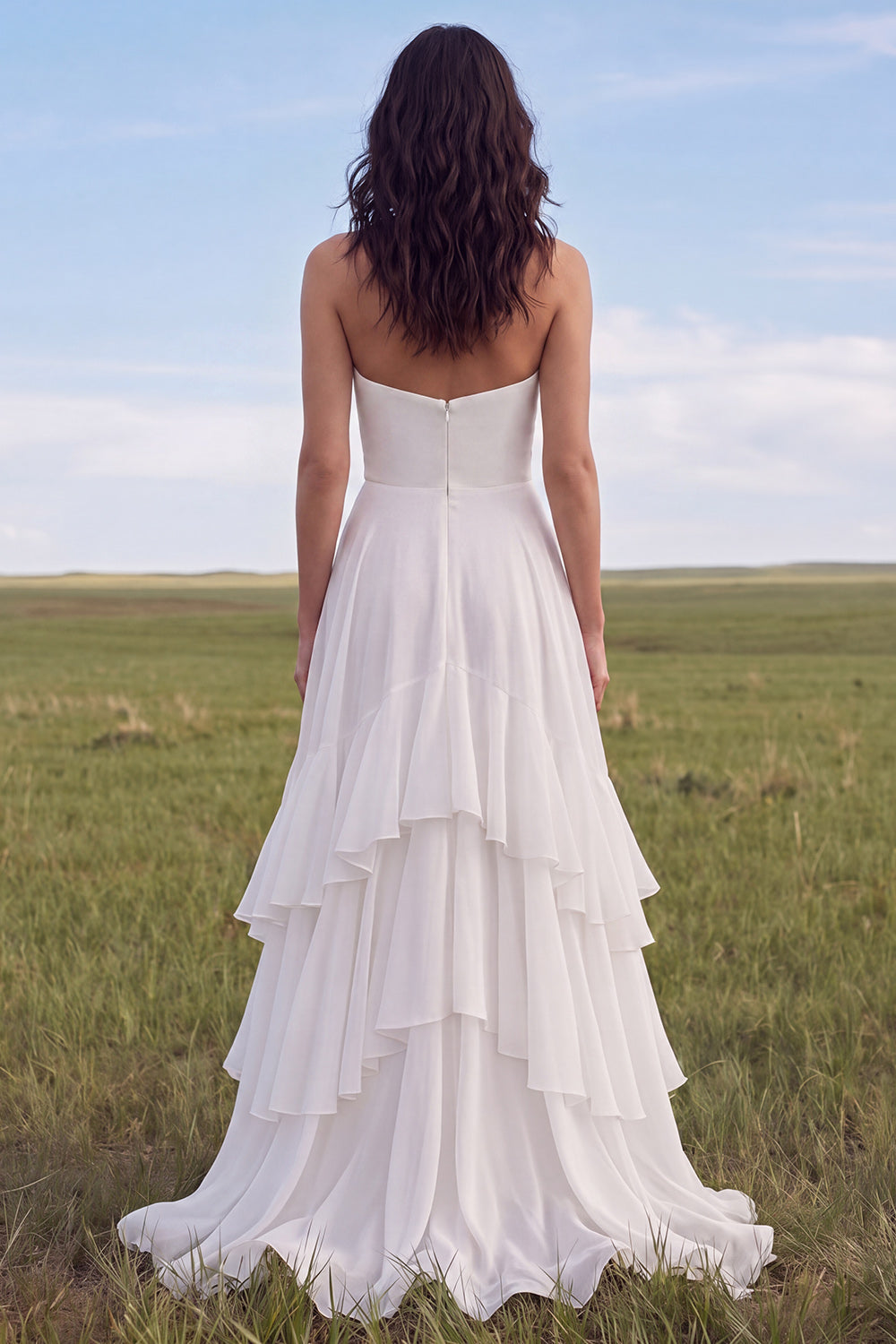 Robe de mariée bustier bohème ivoire évasée avec fente et volants