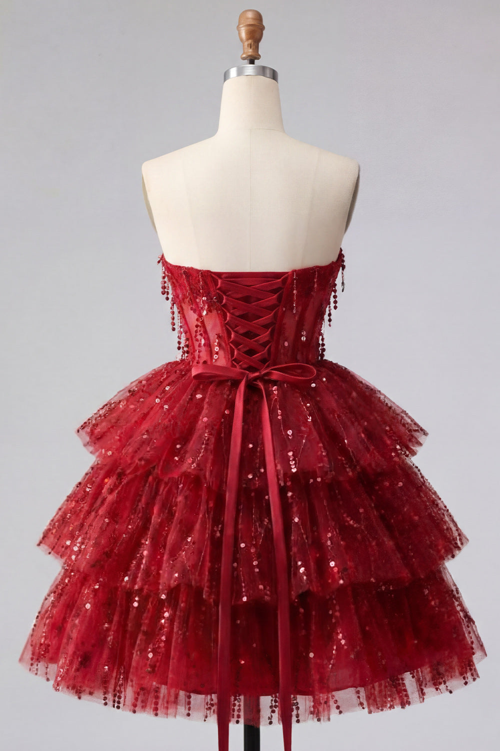 Robe de soirée bustier bordeaux ligne A avec corsage étagé et sequins
