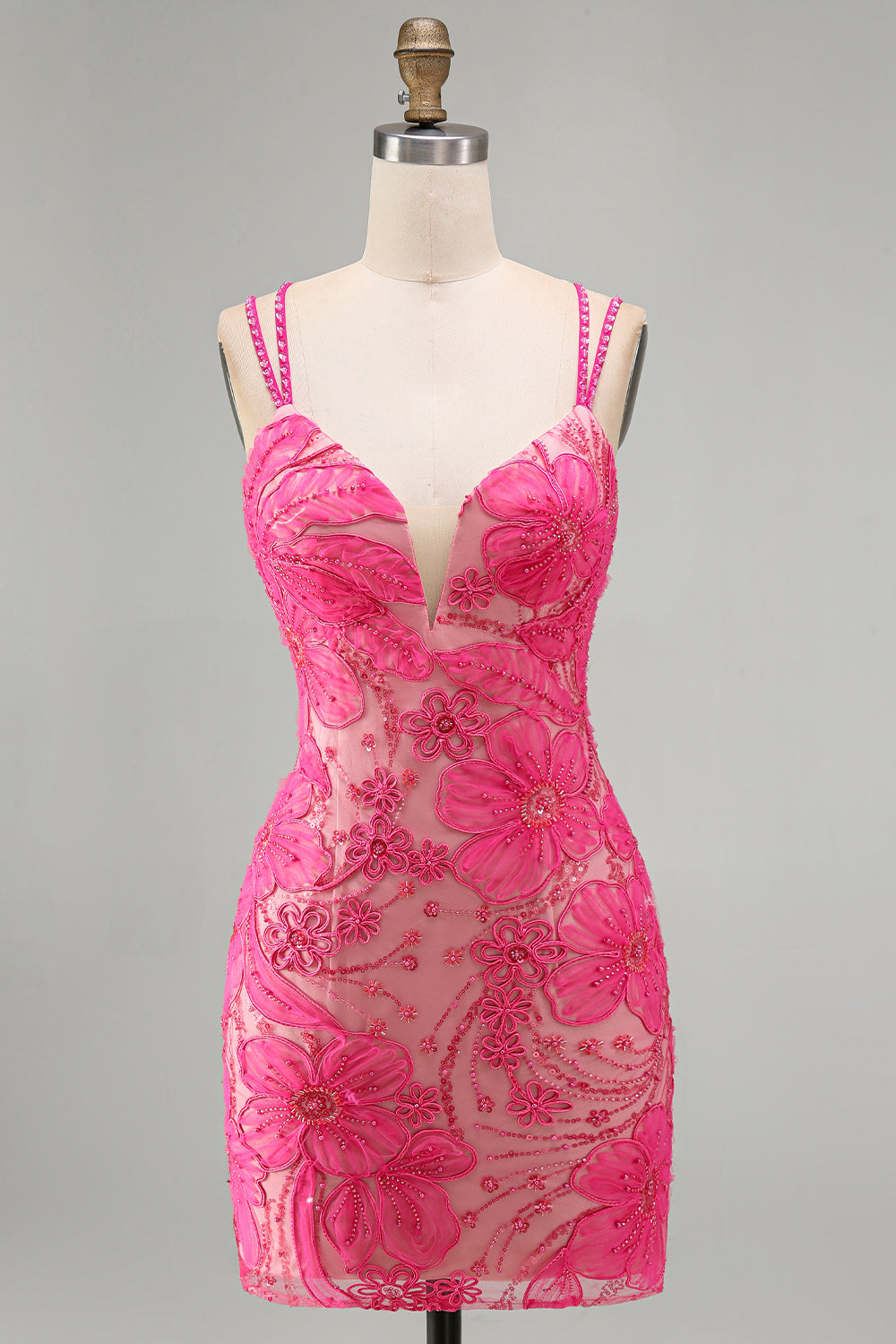 Robe courte de cocktail moulante bleu clair à fines bretelles, motif floral et perles