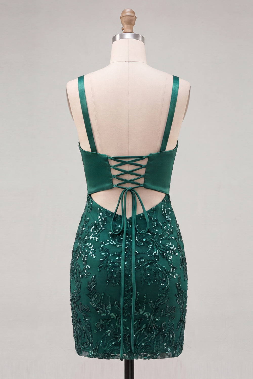 Robe de bal moulante vert foncé à bretelles spaghetti, paillettes et dos lacé avec nœud