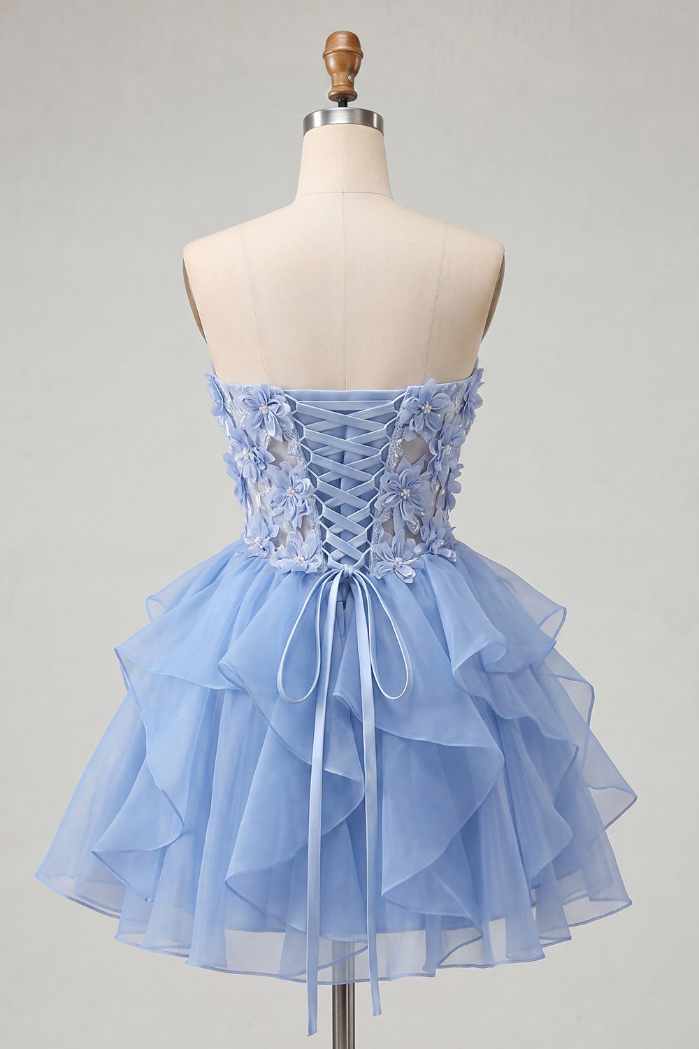 Robe de bal de fin d'année ligne A bleu ciel avec bustier transparent en cœur et dos lacé à volants
