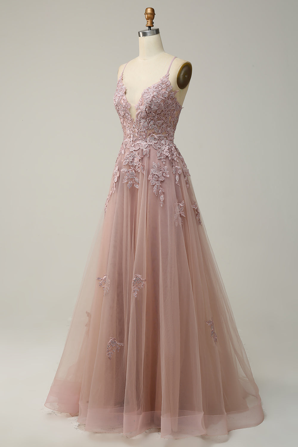Robe de bal longue rose pâle coupe trapèze à fines bretelles et appliques