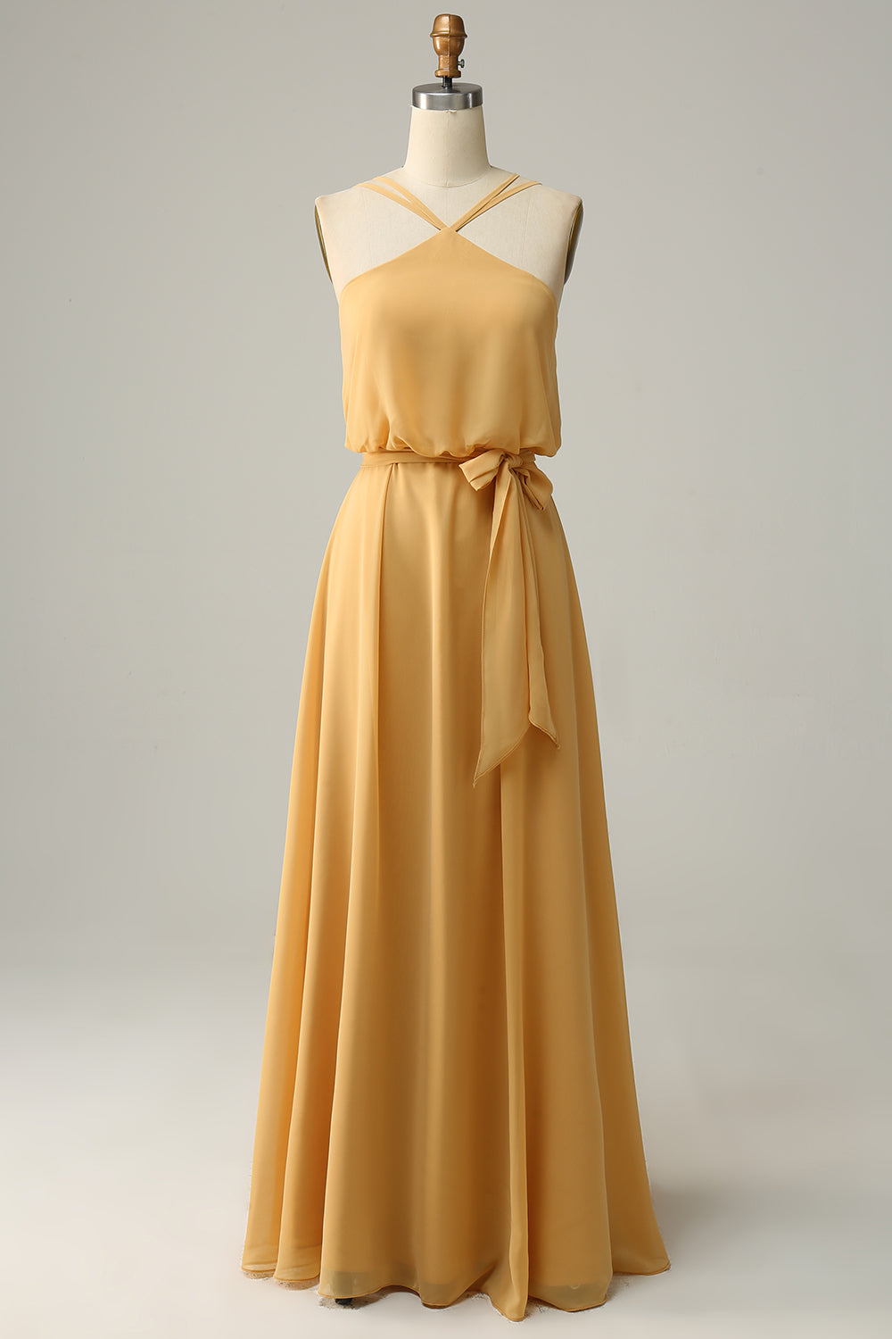 Robe longue de demoiselle d'honneur jaune coupe A, avec licol et nœud.