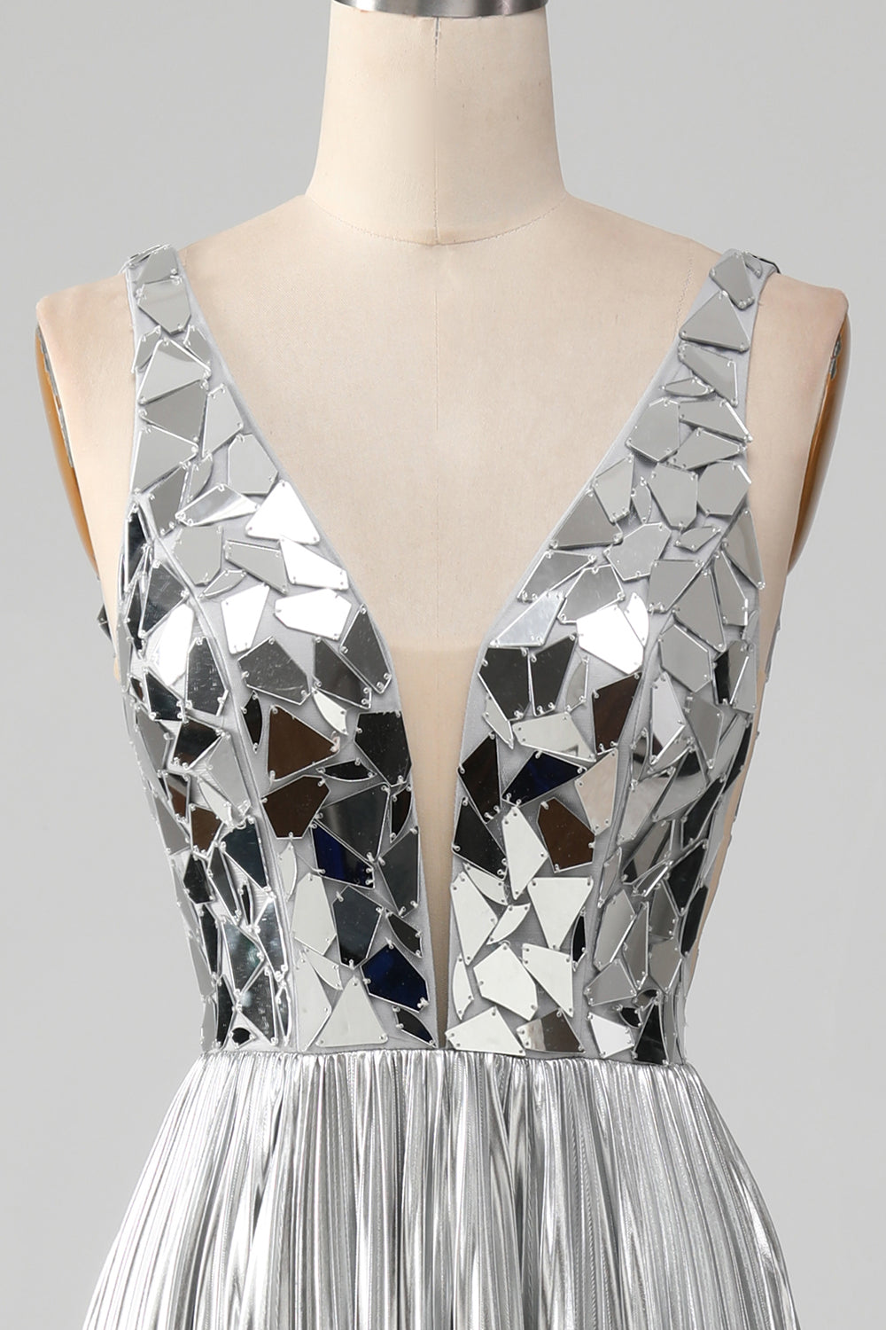 Superbe robe de bal longue dorée coupe trapèze avec décolleté en V et fente avant