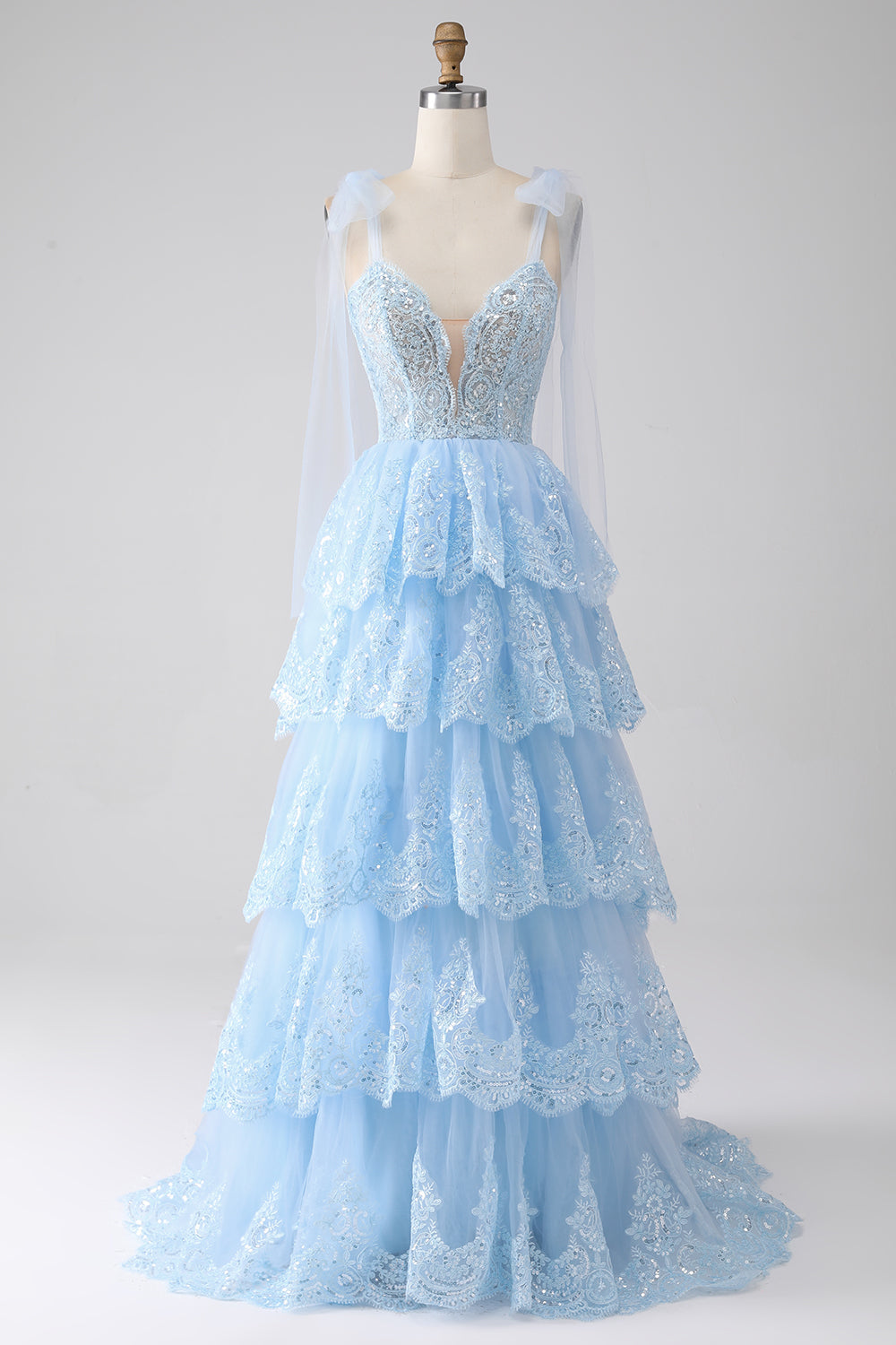 Robe de bal en tulle étagée avec paillettes et appliqués, bretelles nœud papillon, couleur bleu clair