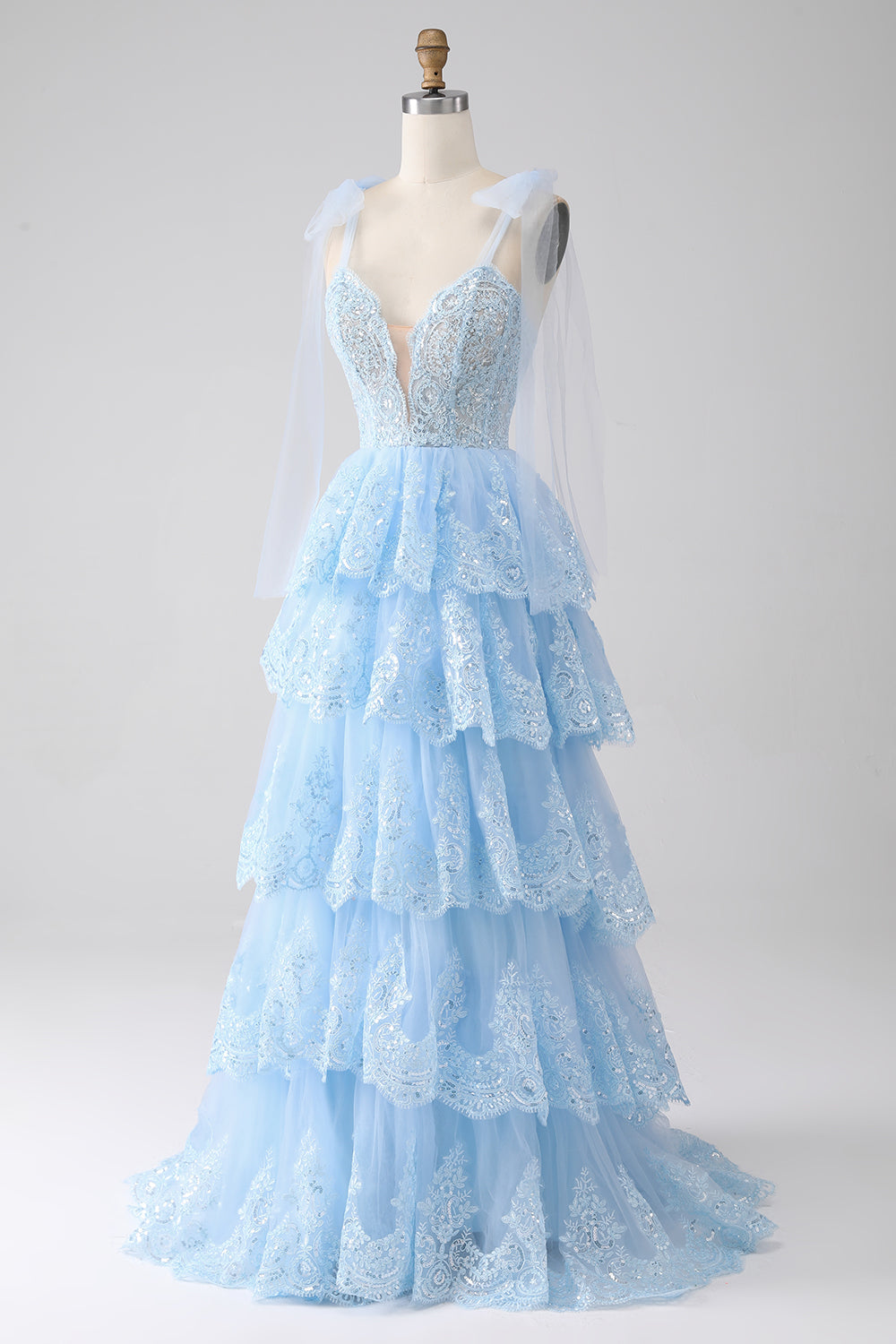 Robe de bal en tulle étagée avec paillettes et appliqués, bretelles nœud papillon, couleur bleu clair