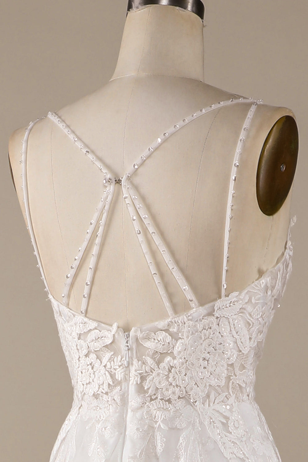 Robe de mariée ivoire trapèze en tulle avec bretelles croisées dans le dos