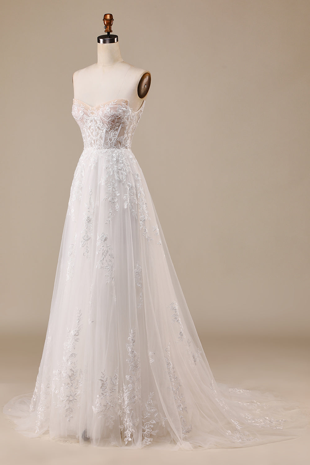 Robe de mariée bustier en tulle ivoire détachable épaules dénudées